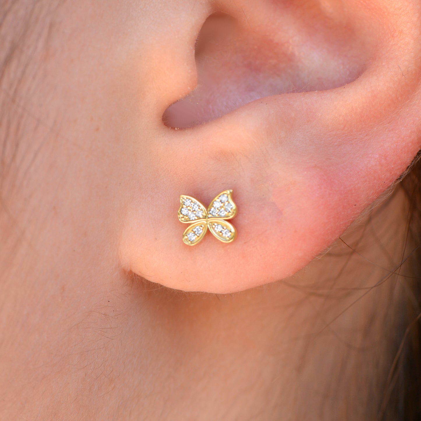 14k yellow gold Diamond Butterfly Stud Earrings on ear