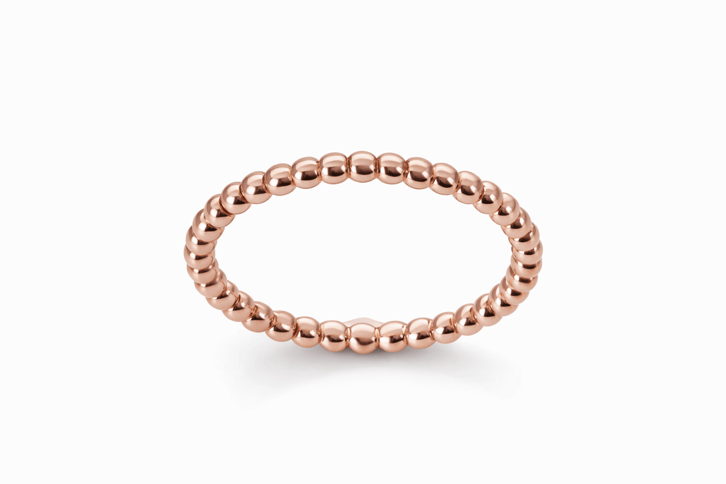 Rose gold beaded ring on a white background