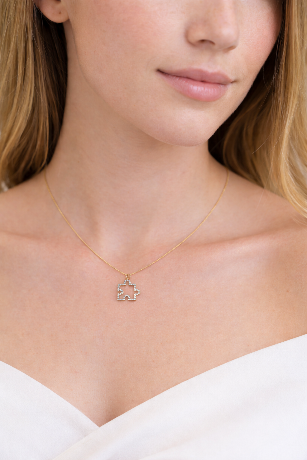 Necklace with a geometric pendant worn by a person