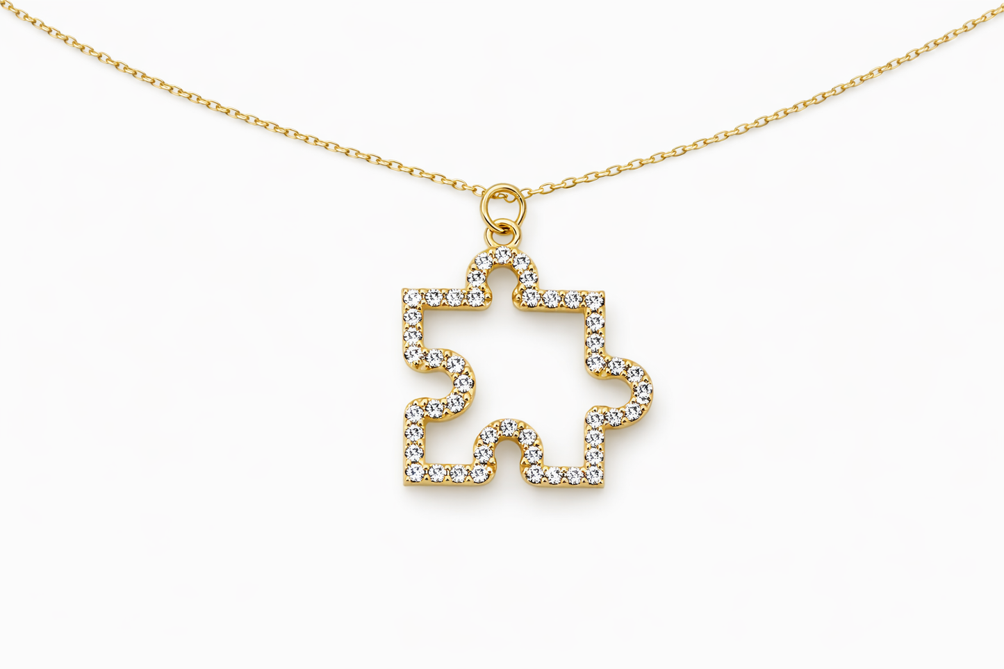 Gold necklace with a star-shaped pendant on a white background
