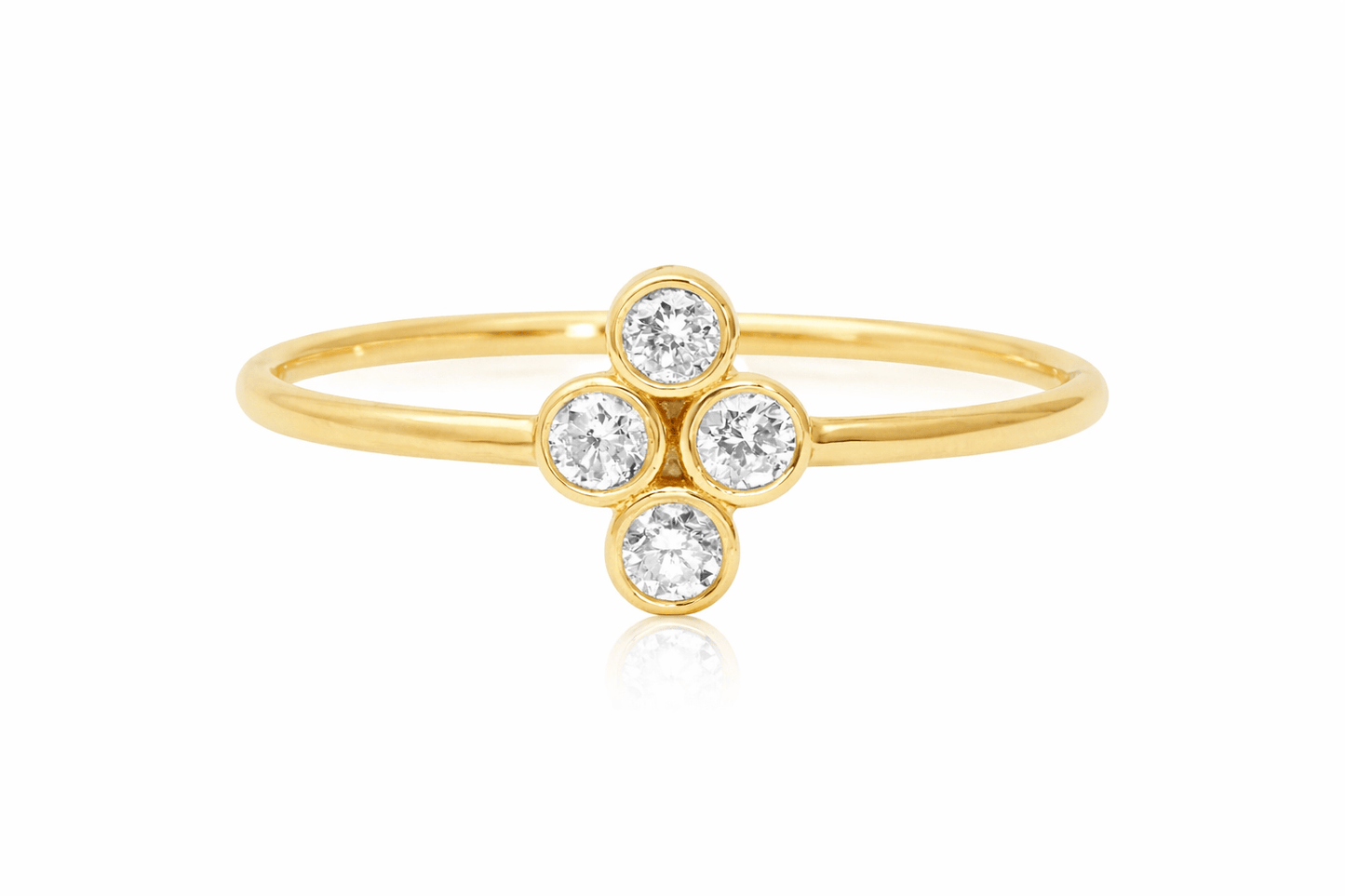 Gold ring with three clear gemstones on a white background
