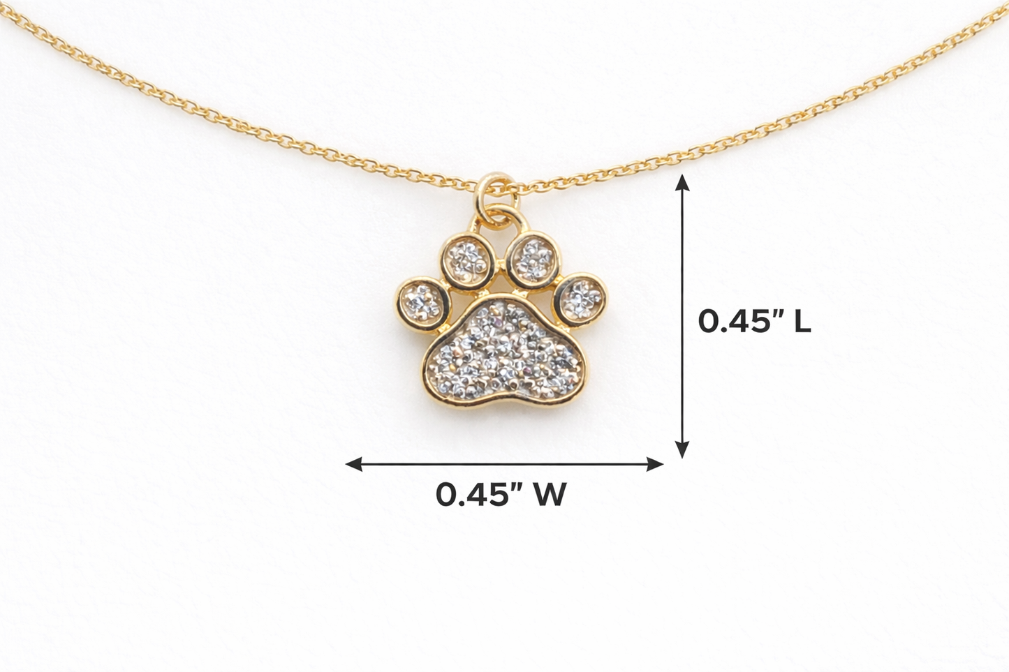 Gold paw print necklace with diamond accents and measurements on a white background