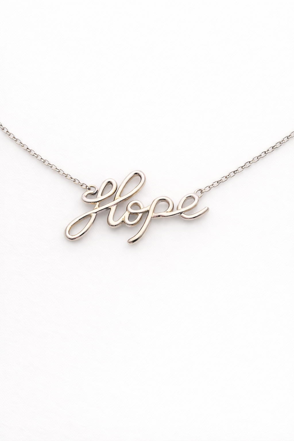 Necklace with 'hope' pendant on a white background
