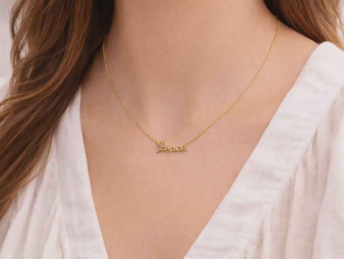 14K Gold Peace Necklace video on model