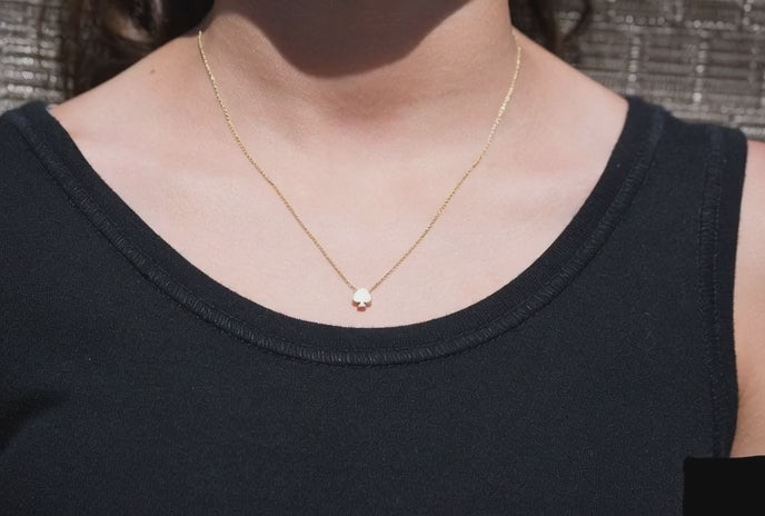 Solid gold spade necklace on model